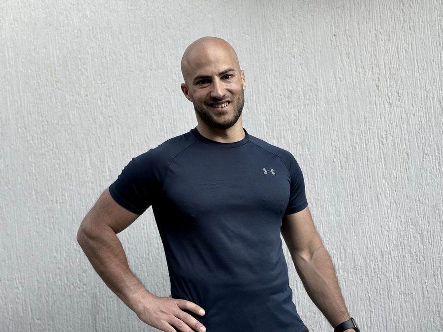 Portrait of Ruben Veres in a navy training shirt.